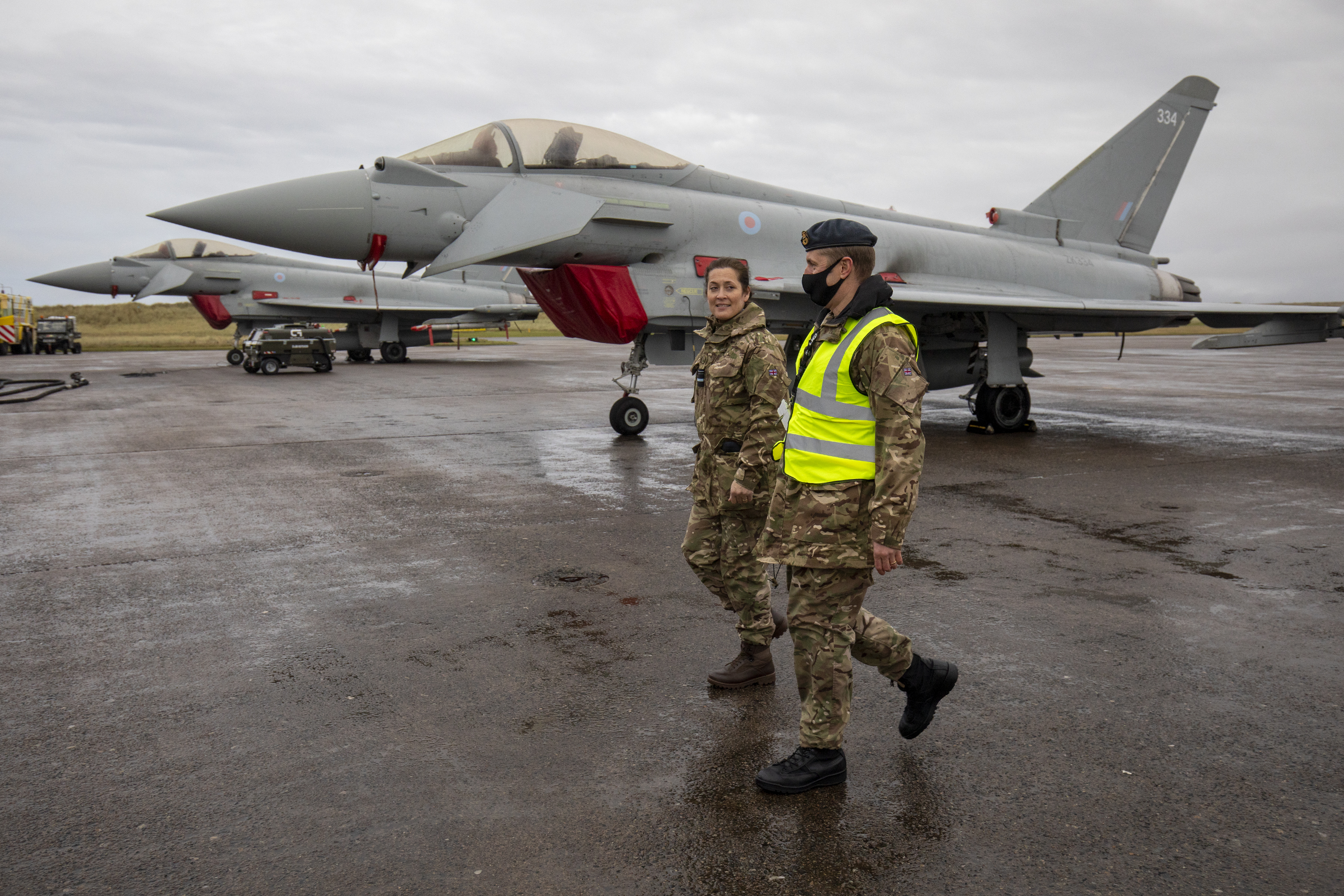 Air Vice Marshal Suraya Marshall walks with personnel, in-front of Typhoon.